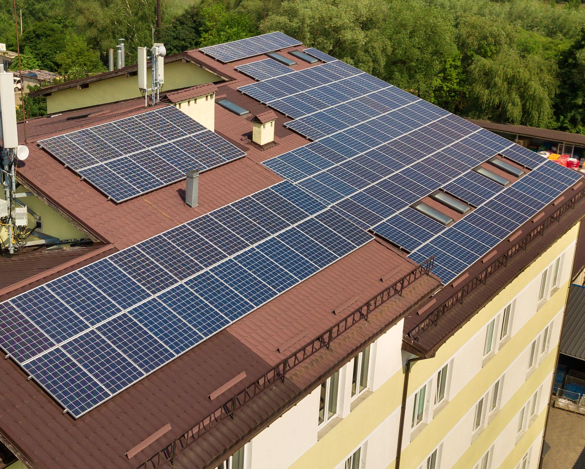 Aerial,View,Of,Many,Solar,Panels,Mounted,Of,Industrial,Building